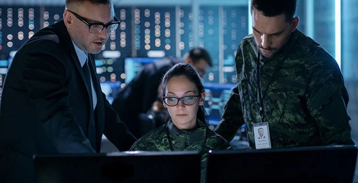 Three people looking at screen showing Altair's MRO solution for aerospace.